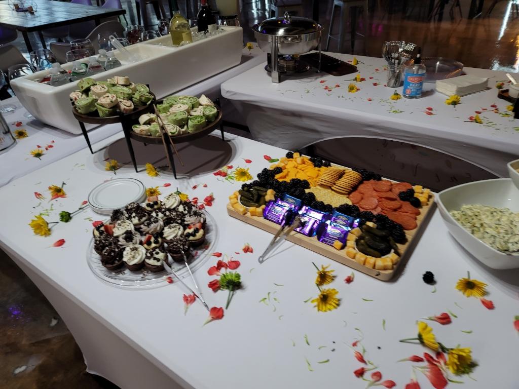 A table with food and flowers on it