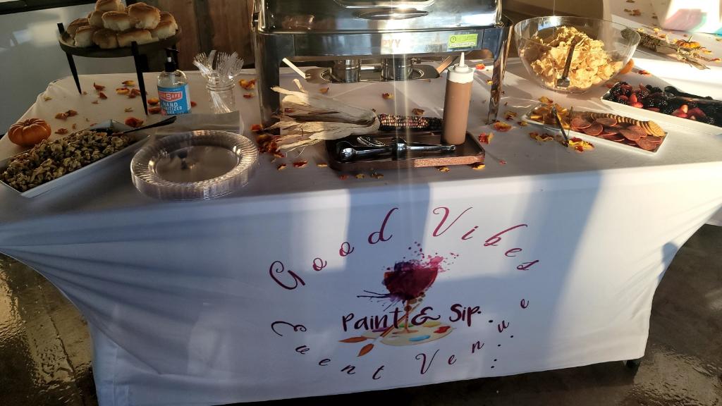A table with food on it and the words " good vibes, great venus ", written in red.