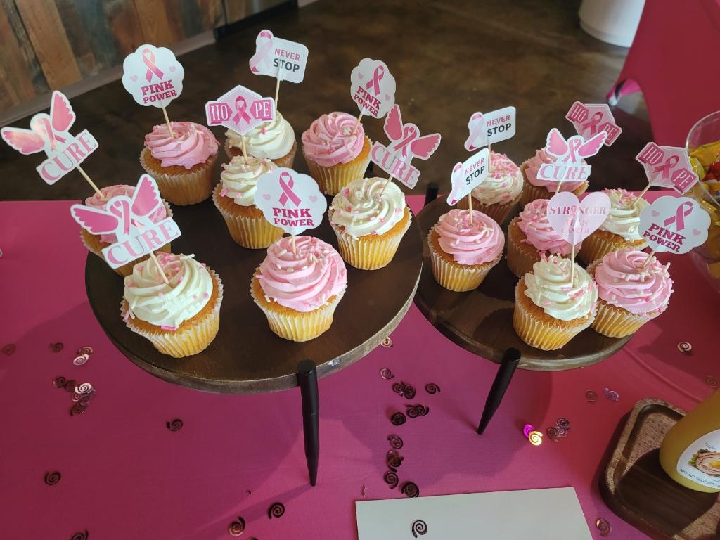 A table with several cupcakes on it