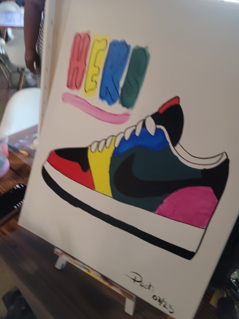 A painting of a sneaker with different colors.